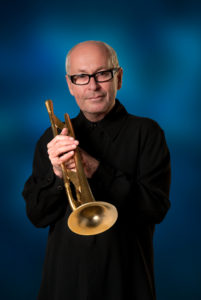 Greg Adams holding trumpet